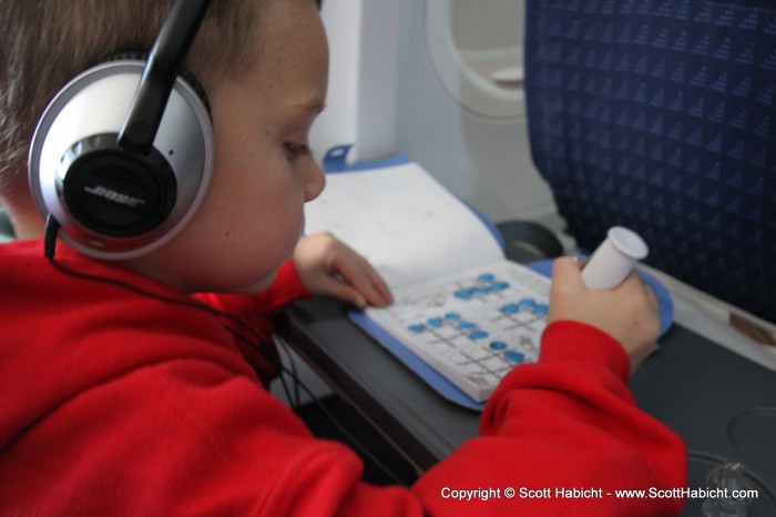 XM radio and a Mickey Mouse book were all he needed the whole trip.