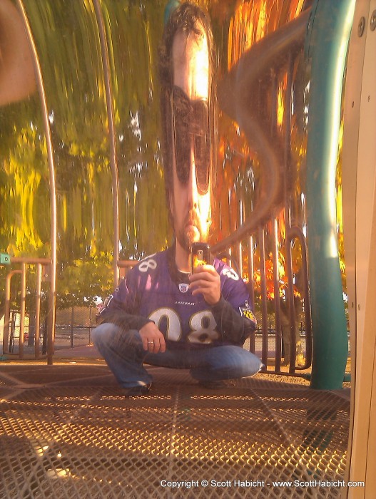 I was having fun playing with a mirror at a playground.