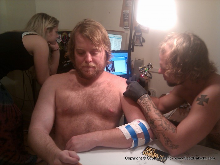 And he was getting a tattoo of the skull in the background.