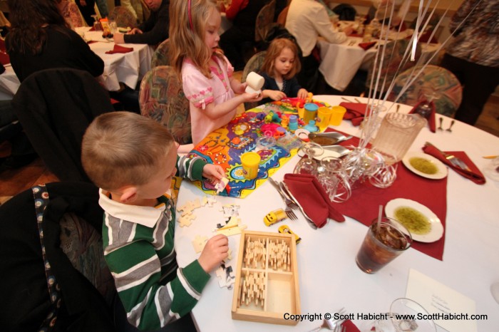 The kids had their own table, and that little girl on the right was enamored with Taylor.