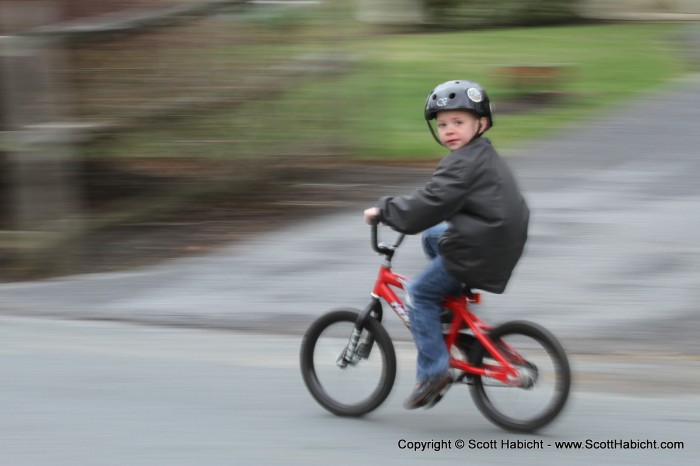 He sure can get going fast on his bike.