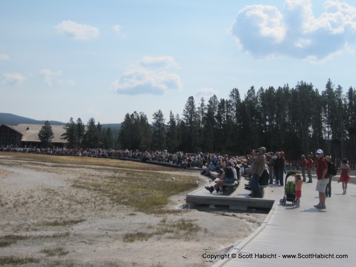 After walking around it had been enough time for Old Faithful to go off again. These are all people waiting for it.