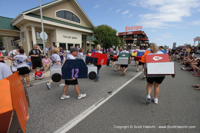 The race cars are all the opponents of the Ravens in the 2012 season.