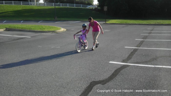 Teaching Sophia how to ride a bike.