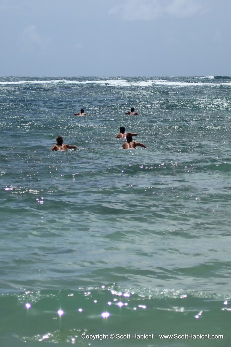 Surfers heading out to surf.