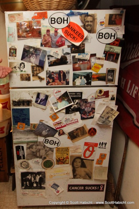 An odd assortment of items on a fridge.