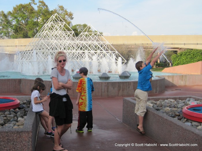 Under which I made Kelli stand. Thanks, random kid on the right, for splashing the water and getting Kelli wet.