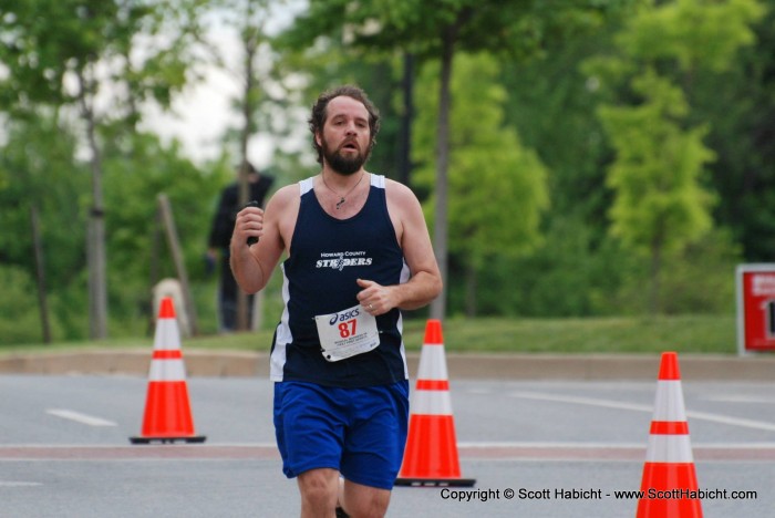 Finishing a race with my phone in hand so I could add it to mapmyrun.com. As a note, I missed a 5K PR (Personal Record) by 5 seconds.