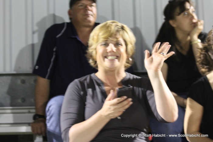 Courtney is part of the cheering section in the stands.