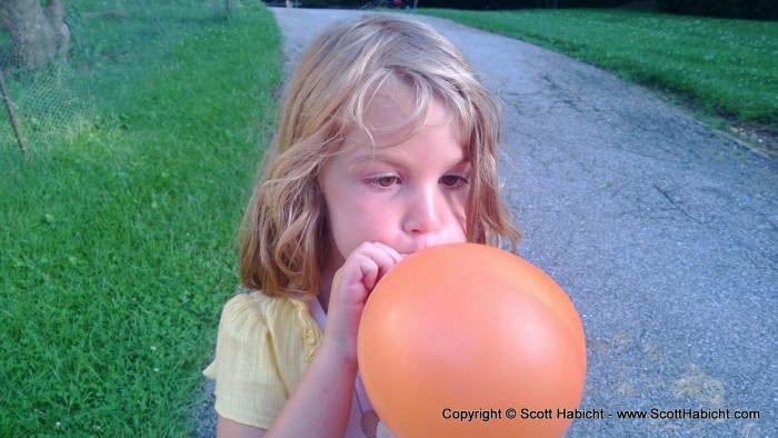 Amber doing her best to blow up a ballon.