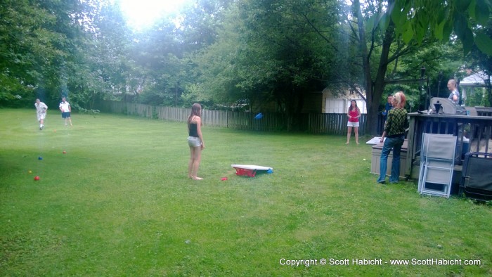 Playing some bocce ball and cornhole.