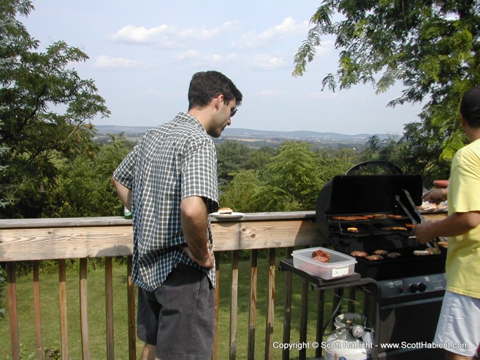 Jeff waits for the burgers while enjoying the view.