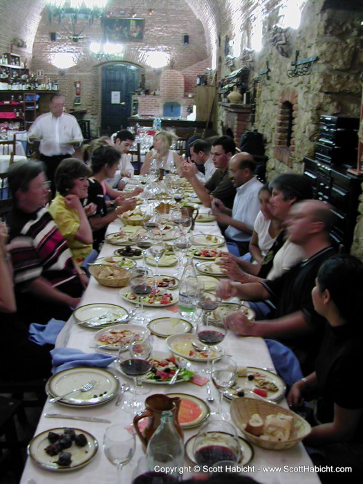 The wedding party eats at the restaurant.