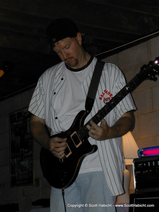 Scott Gray plays guitar.