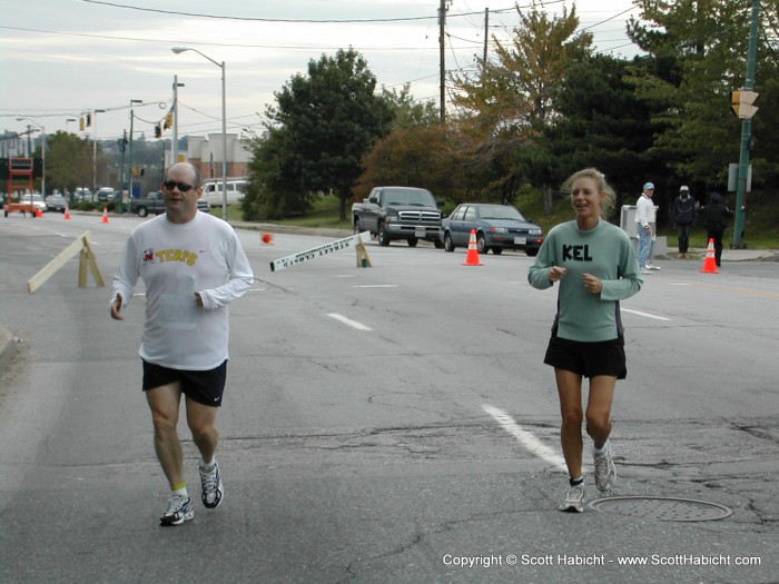 Making the turn at mile 11. I put "KEL" on her shirt so people would cheer for her as she ran.