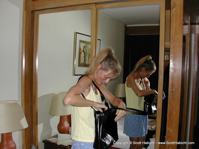 Kelli trying on her new handbag that I bought her.