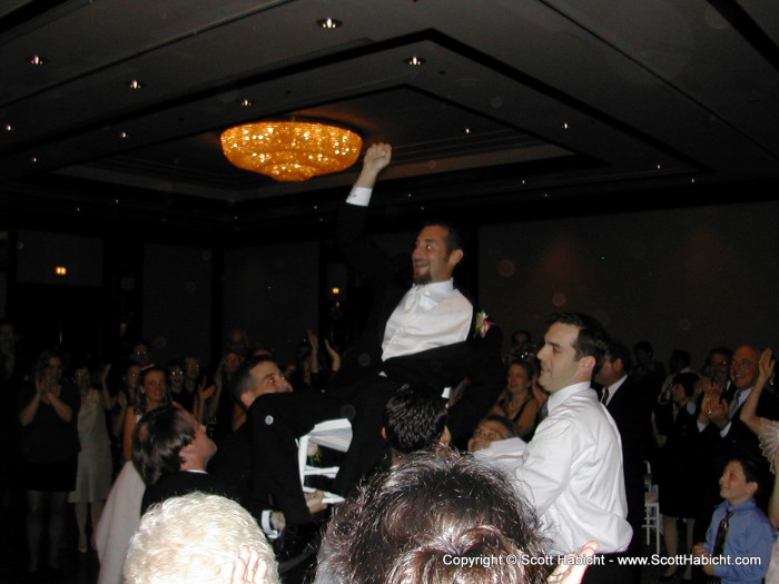 Apparently in the Jewish tradition, you put the bride and groom in chairs and throw them up in the air while listening to "hora" style music.