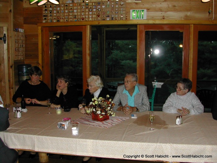 The older crowd waits for the food.