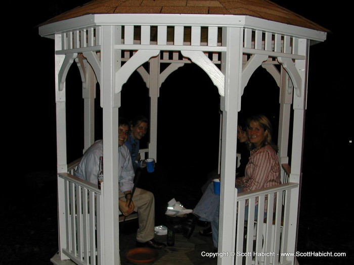 Everyone else lines up in the gazebo for a shot, after becoming bored with waiting to play.