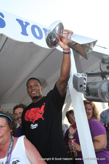 Ed Dickson raising the Lombardi Trophy for the crowd to go wild about. Notice the markings on the bottom of the trophy?