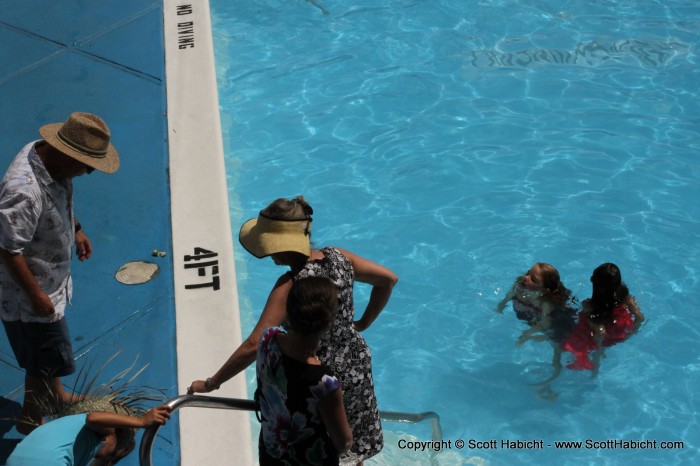 The kids were a little too hot, so they jumped in the pool...with their dresses on!!!