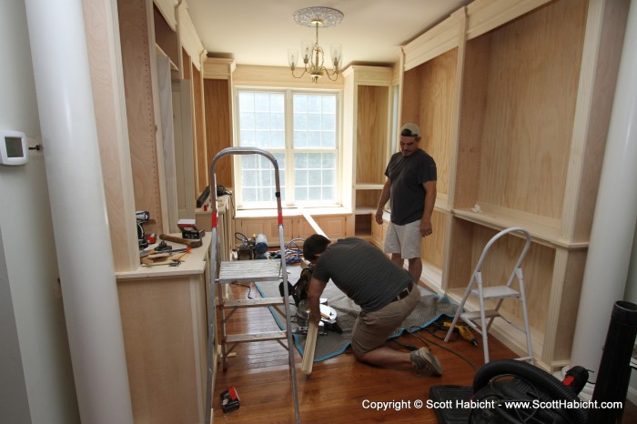 More library work. Here they are cutting the molding to fit.