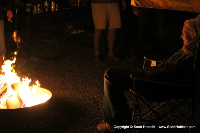 Kel was happy to be next to the warmth of the fire.