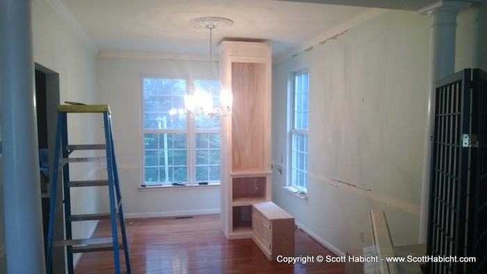 The beginning of turning the dining room into a library.