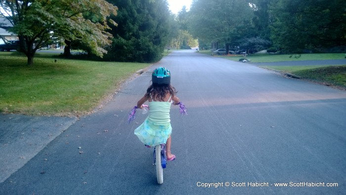 Sophia is getting much better at riding her bike...