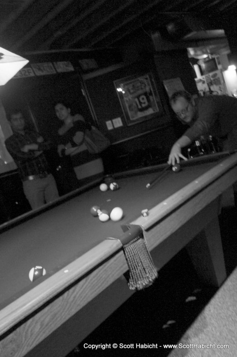 Peter playing pool.