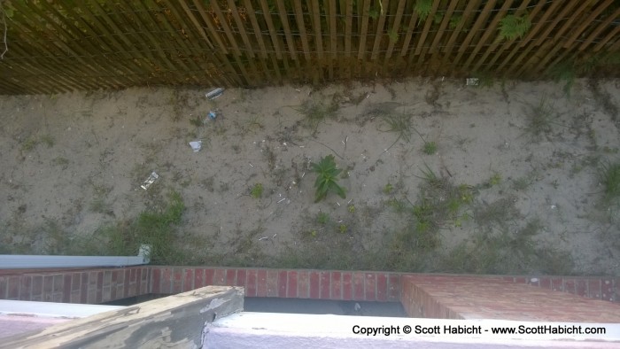 The renters above us in Bill's unit seem to think over the balcony is a good place for trash.