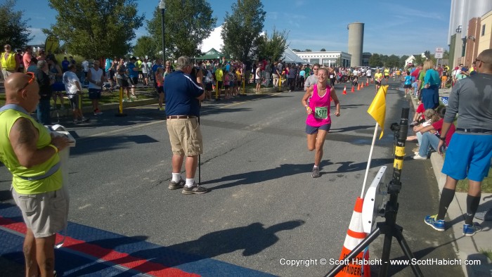 Kelli, crossing the finish line.