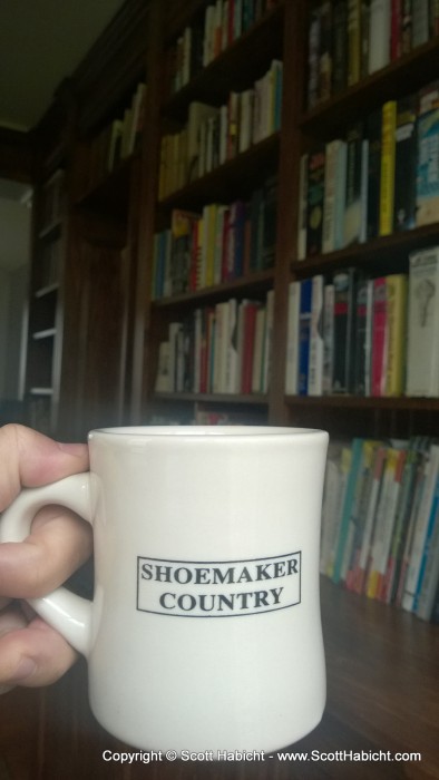 In the library with my coffee. (Shoemaker Country built my library).