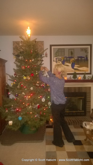 Finishing decorating the tree the day after coming home from the beach.