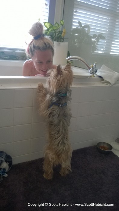 Kelli says hello to Riley while enjoying a bath.