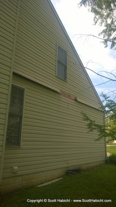 Crap, the wind blew siding off my house.