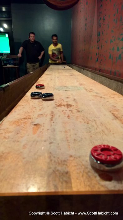 After sushi I played shuffleboard with my co-workers.