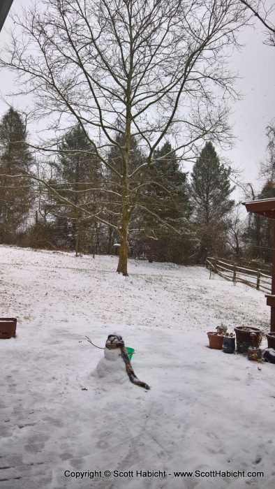 Stopping by my parents' house, and it seems my neice, Amber, built a snowman.